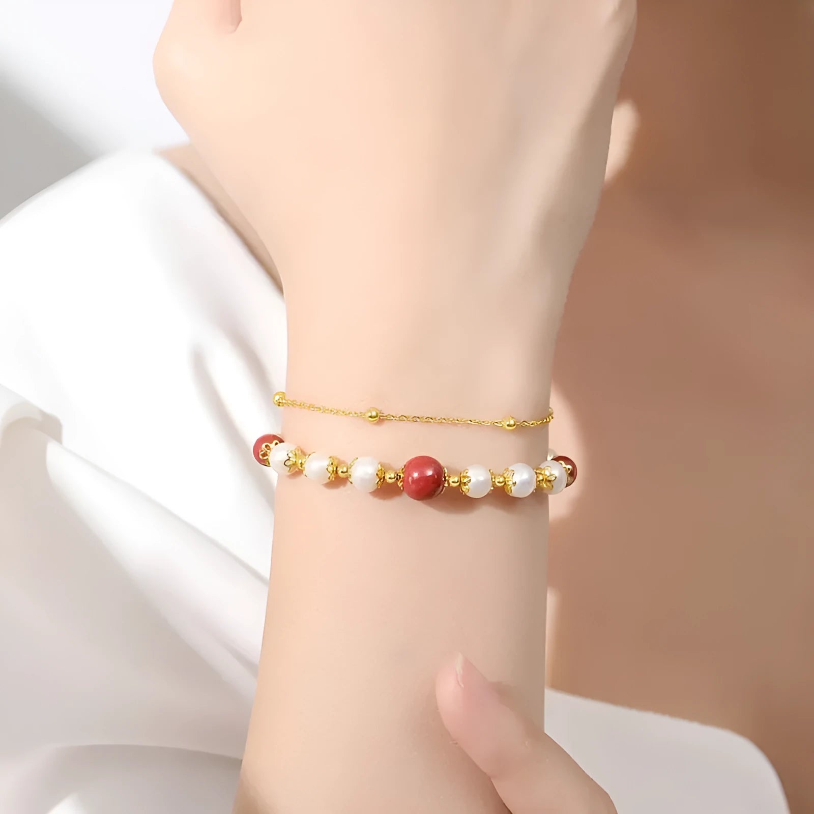 Sterling silver double-layer bracelet with white freshwater pearls and cinnabar red bean geometric design