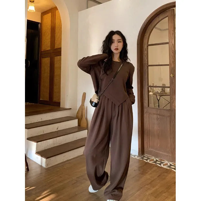 Women's loose khaki casual sports suit set with long sleeves and trousers on a hanger.