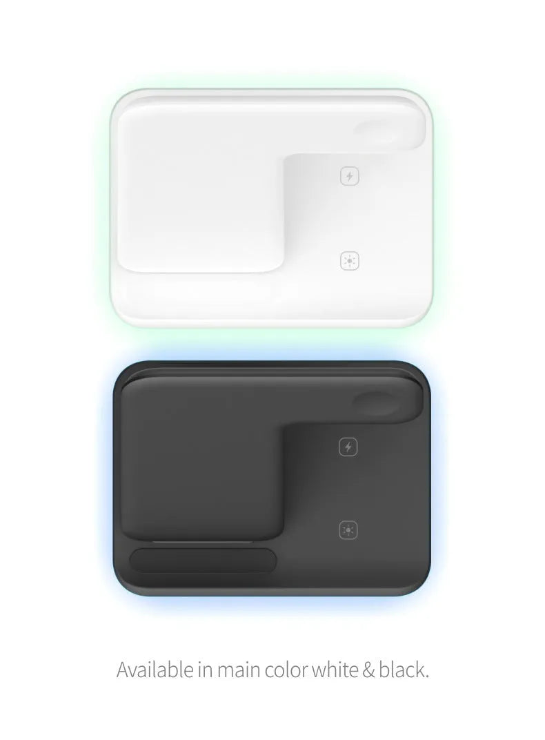 White three-device wireless charging stand on desktop with phone, watch, and headset charging simultaneously