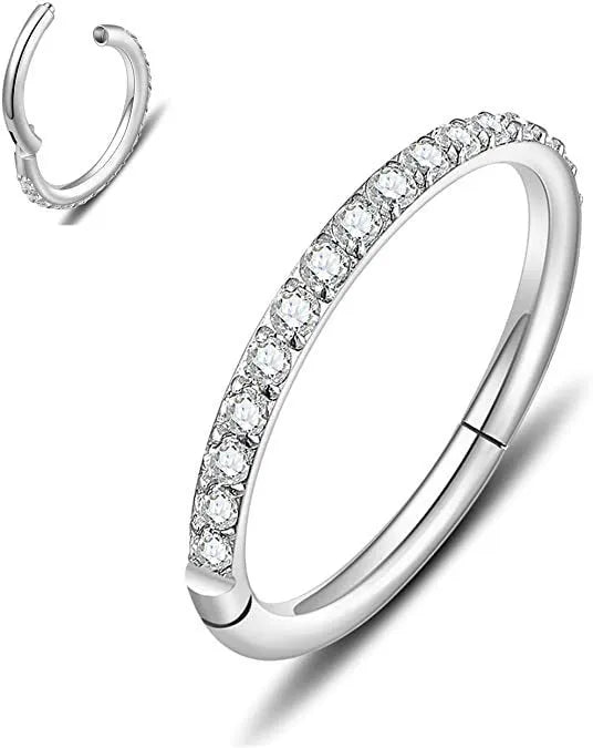 A stainless steel seamless nose ring with a diamond setting, shown in gold, rose gold, black, and steel finishes.