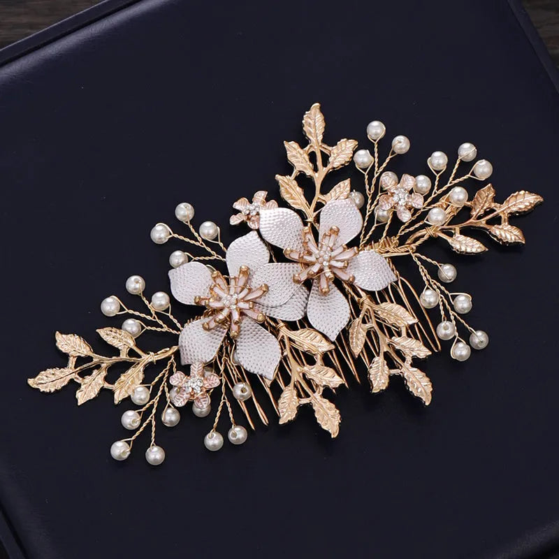 Gold bridal hair comb with pearl and white crystal flower design on head