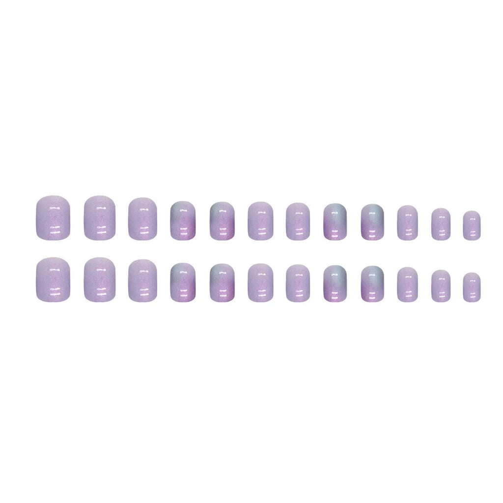 Short false nails with bright Aurora starry sky pattern and included glue tube.