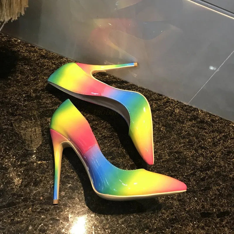 Women's rainbow patent leather high heel court shoes with pointed toe and thin ultra-high heel.