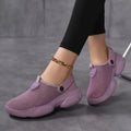 Women's black Flyknit casual sports sandals with round toe on a neutral background.