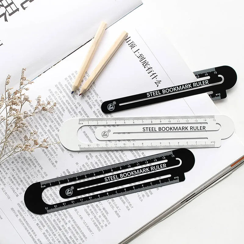 Black and white two-sided metal ruler showing 12cm measurement scales.