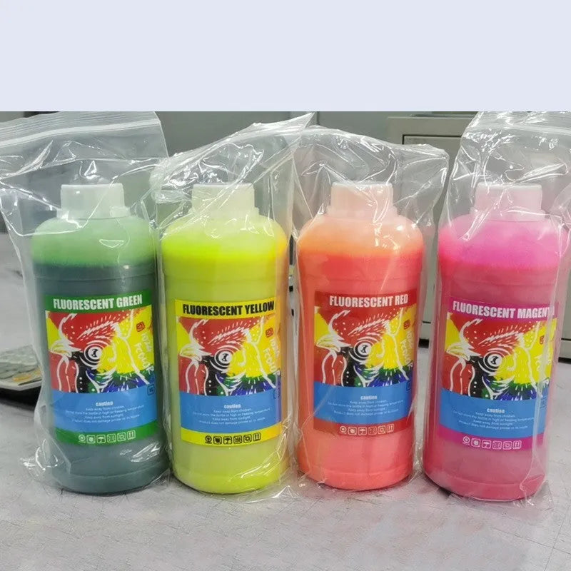 Fluorescent sublimation ink bottles for PET film printing in red, yellow, orange, and green colours