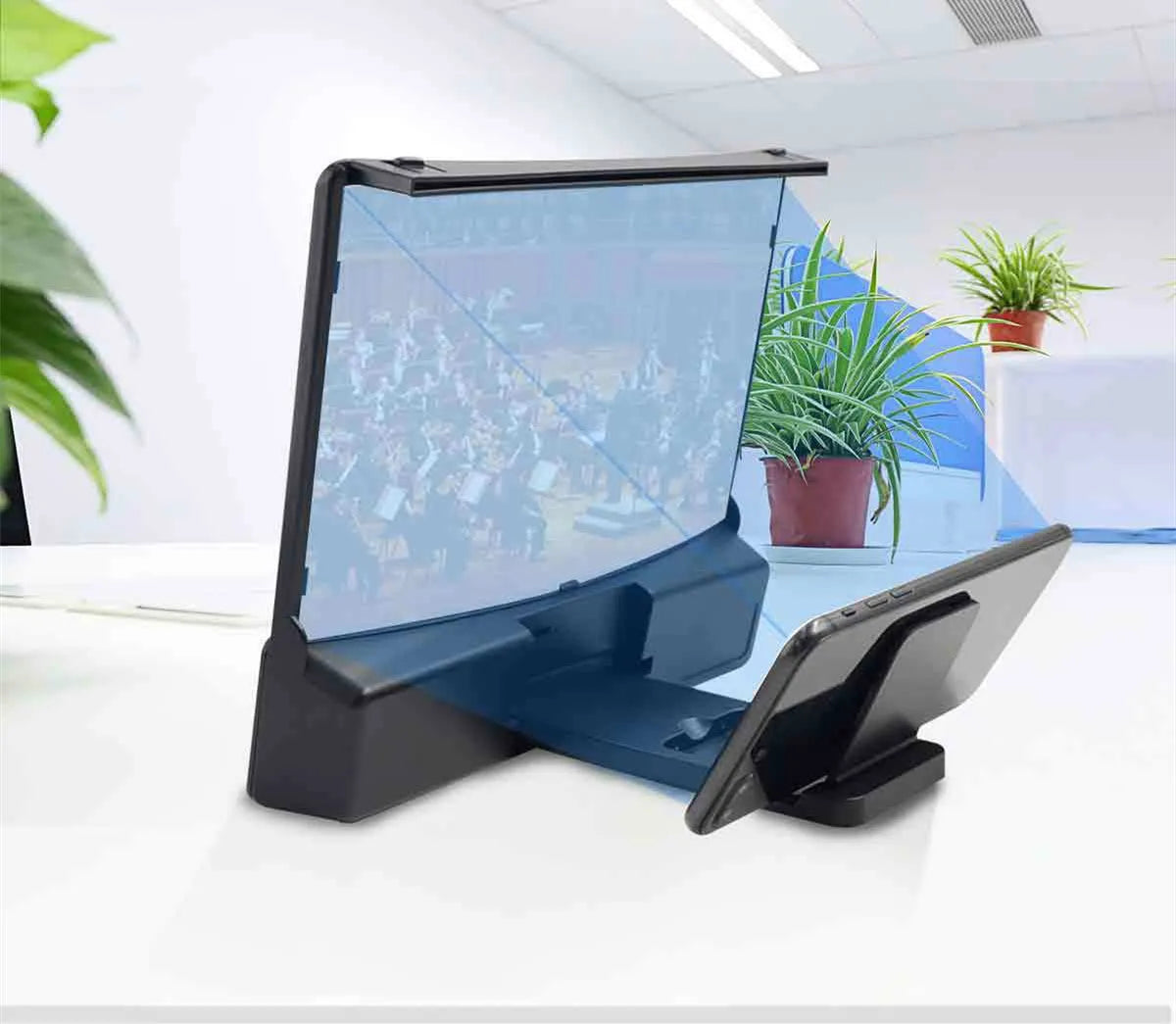 10 inch curved acrylic mobile phone screen magnifier with black ABS shell and integrated Bluetooth speaker, set on a table with a phone inside
