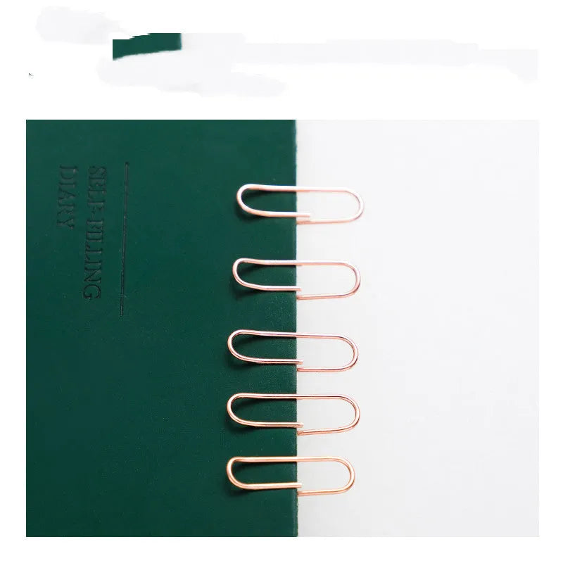 Rose gold heart-shaped metal paper clips in a box, size 28mm.