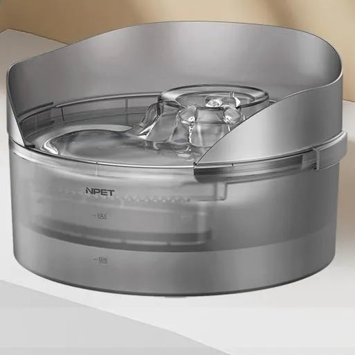 Automatic pet water fountain for cats and dogs with a water pump and filter cartridge.