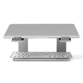 Black aluminium alloy laptop stand on wooden desk with laptop positioned on top