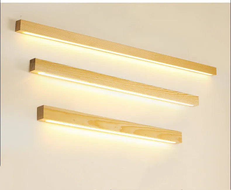 Walnut colour wood and acrylic log strip wall lamp in three lengths with integrated LED lighting