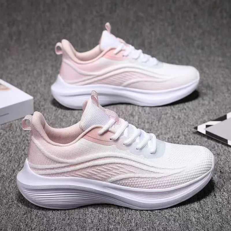 Women's lightweight running shoes with breathable mesh upper, flat heel, and front lace-up closure