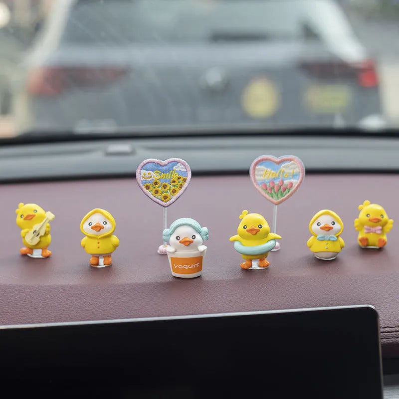 PVC cartoon duckling car decoration set with six ducks and one Hello sign.