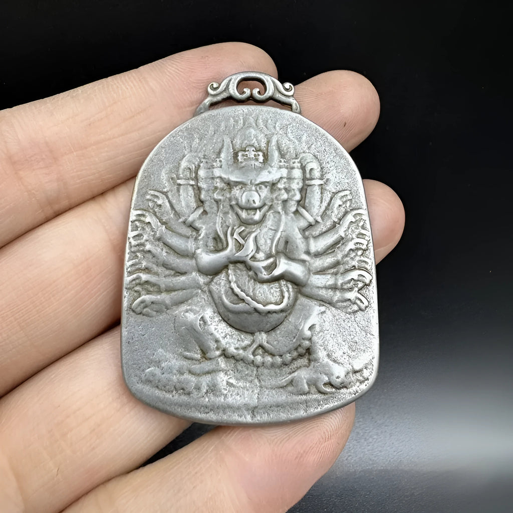 Chinese style antique iron geometrical hanging ornament pendant on a wall.
