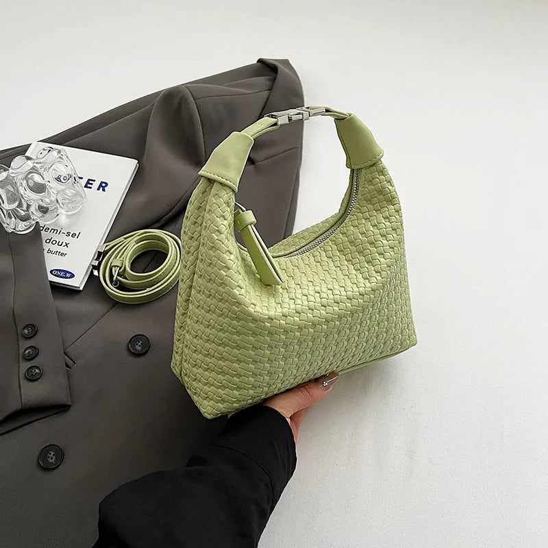 Soft PU leather bucket-style messenger bag in beige with a front sandwich pocket and shoulder strap.