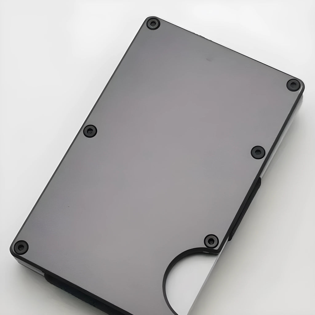 Aluminium alloy grey carbon fibre credit card wallet with RFID blocking, showing seven card slots.