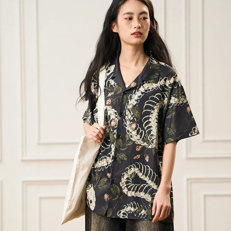 Original snake bone theme floral print on a loose, short sleeve Cuban collar shirt in assorted colours.