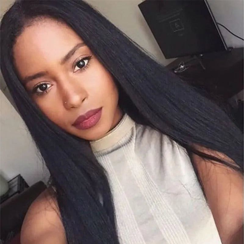 Long straight black synthetic wig with centre-parted bangs on a hair cover