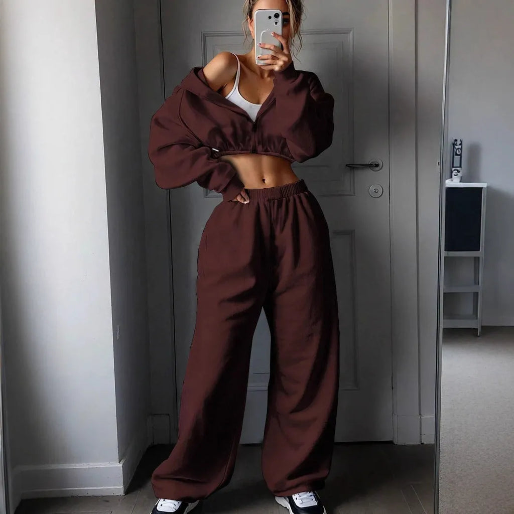 Long sleeve polyester sports suit two-piece set in light grey, shown as coat and trousers.
