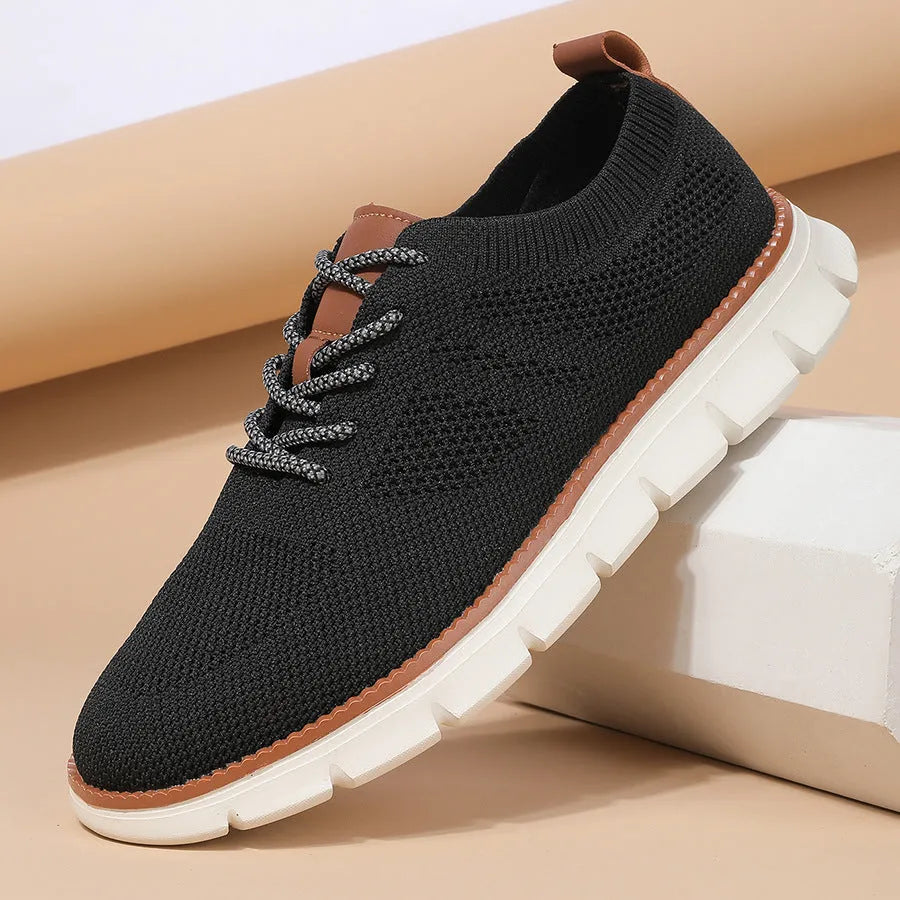 Men's grey mesh casual sneakers with round toe and low-cut design on a white background.