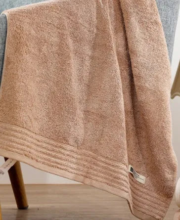 Cotton towel set showing beige and brown options with 34cm and 70cm sizes