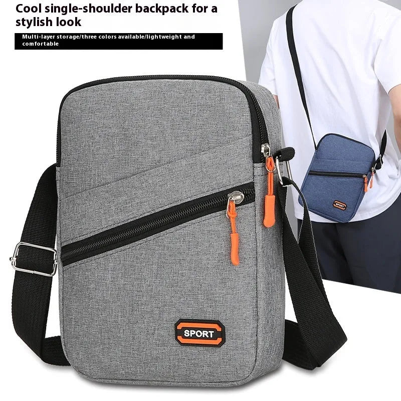 Ultra light Oxford cloth crossbody commuter bag in silver grey, black or navy blue.
