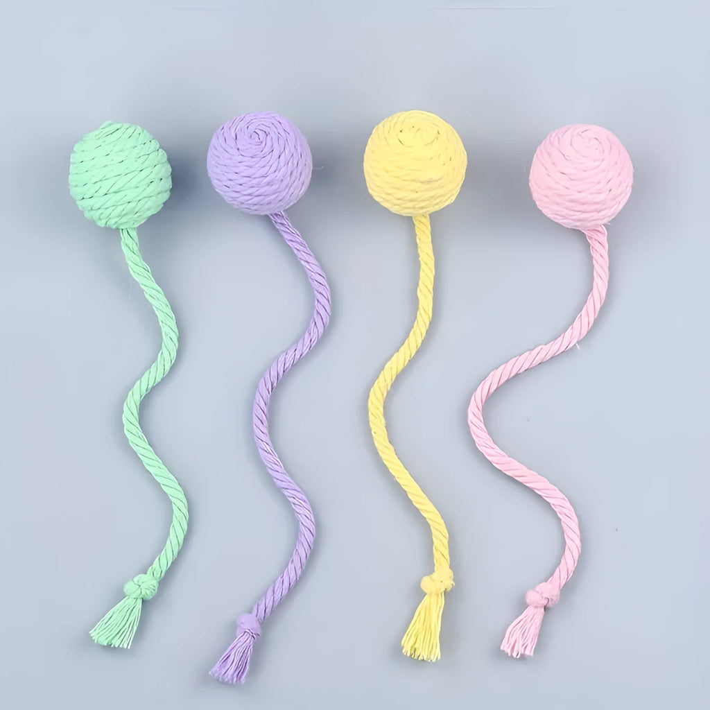 Fabric cat toy ball with rope attached in green, pink, purple, or yellow colours