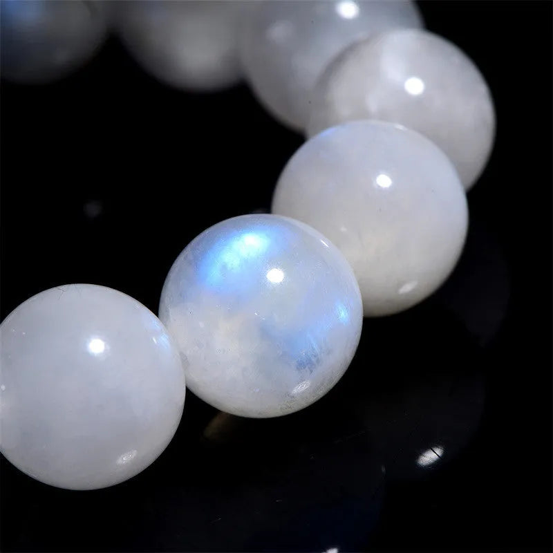 Natural blue moonlight round bead moonstone bracelet in white colour showing polished geometry-shaped beads