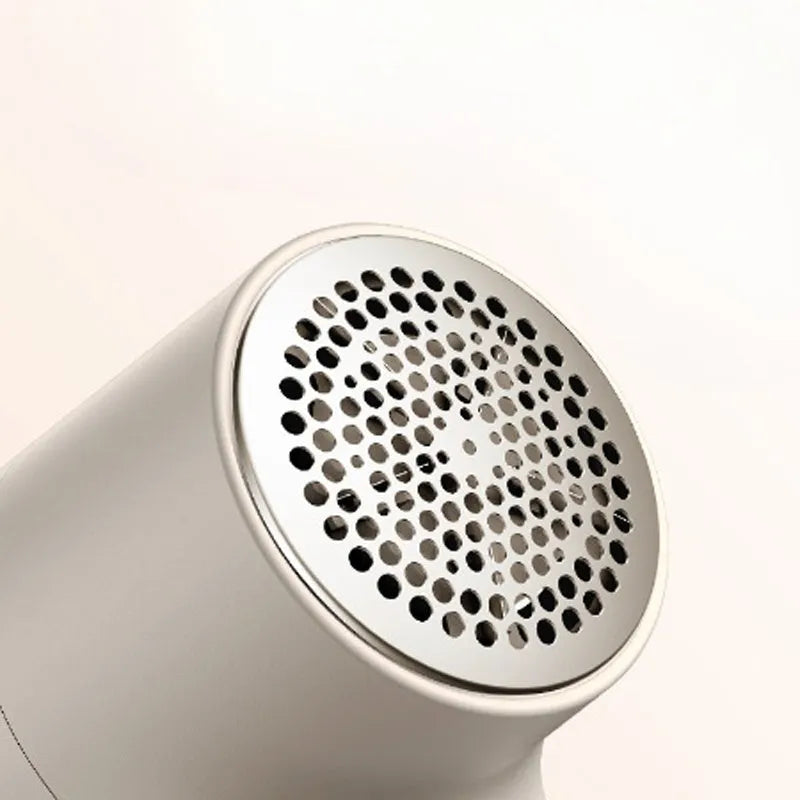 White electric lint remover with LED display showing dimensions 126x73x68mm
