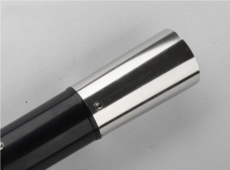 Black electric fish scale descaling tool with brush head on white background