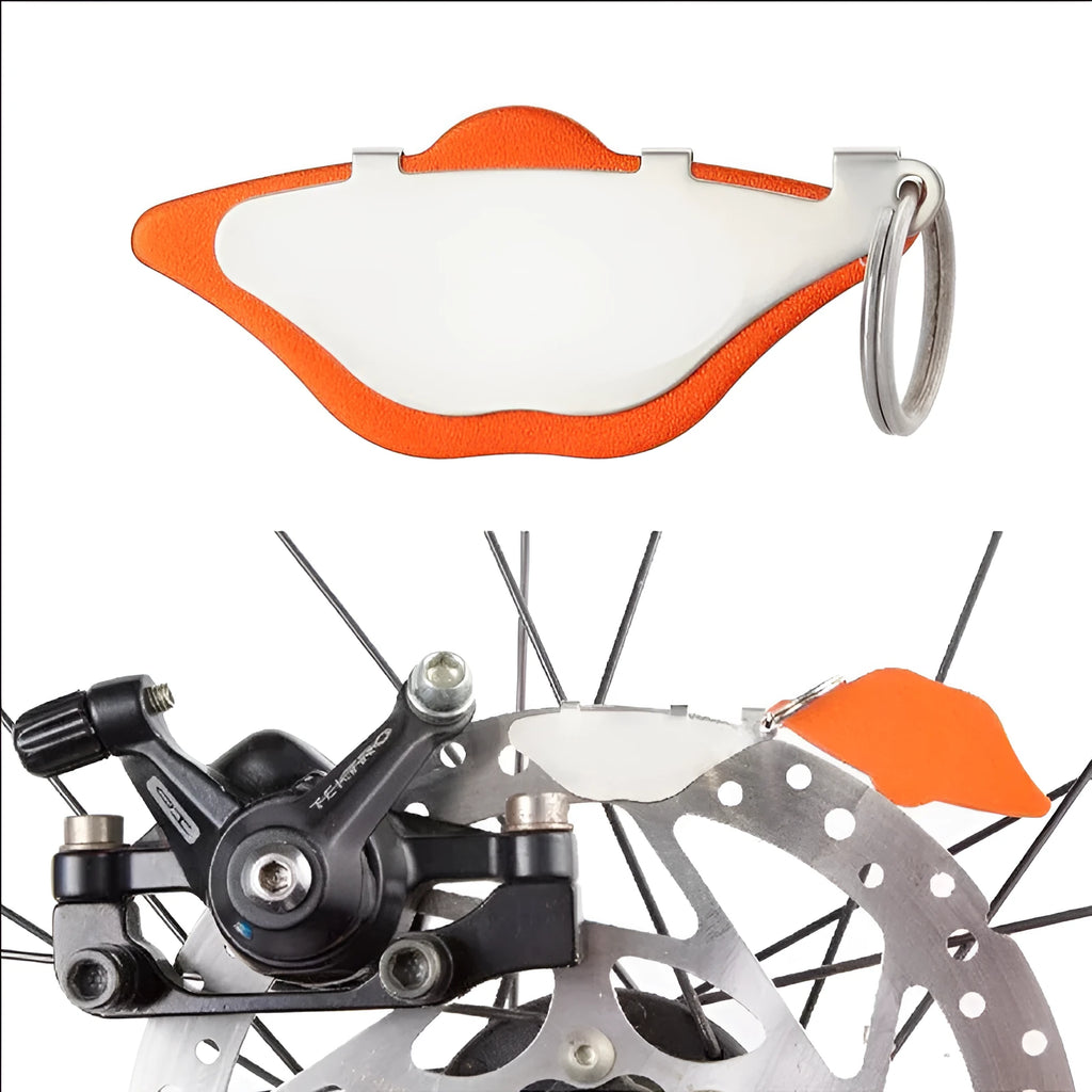 Mountain bike disc brake pads metal brake linings in black and orange colours