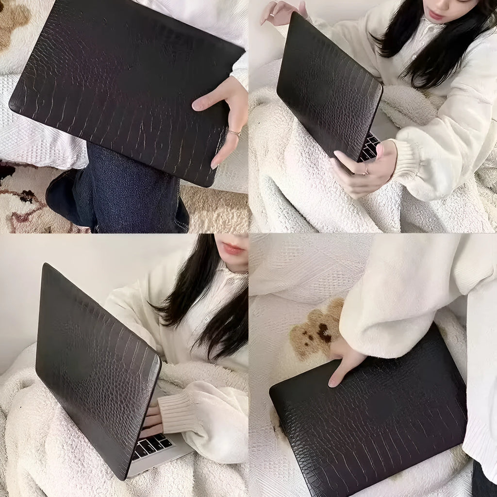 Black MacBook protective case with crocodile texture and visible Apple logo through a cutout.