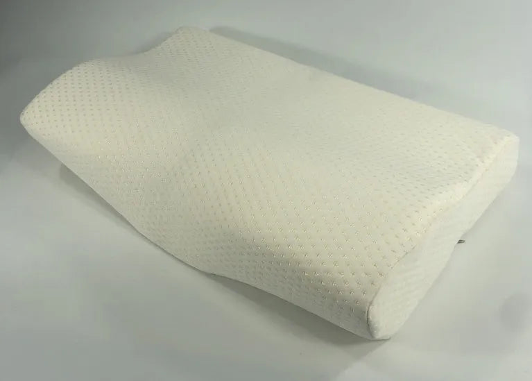 Blue butterfly-shaped memory foam cervical neck pillow on a bed