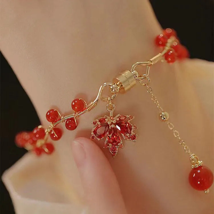 Red Chinese style magnetic bracelet with ginkgo leaf design and electroplated finish