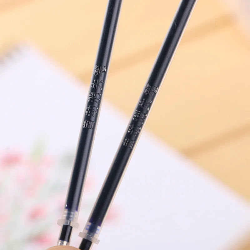 Automatic fade and disappear pen set showing pen holder, case, and eight refills