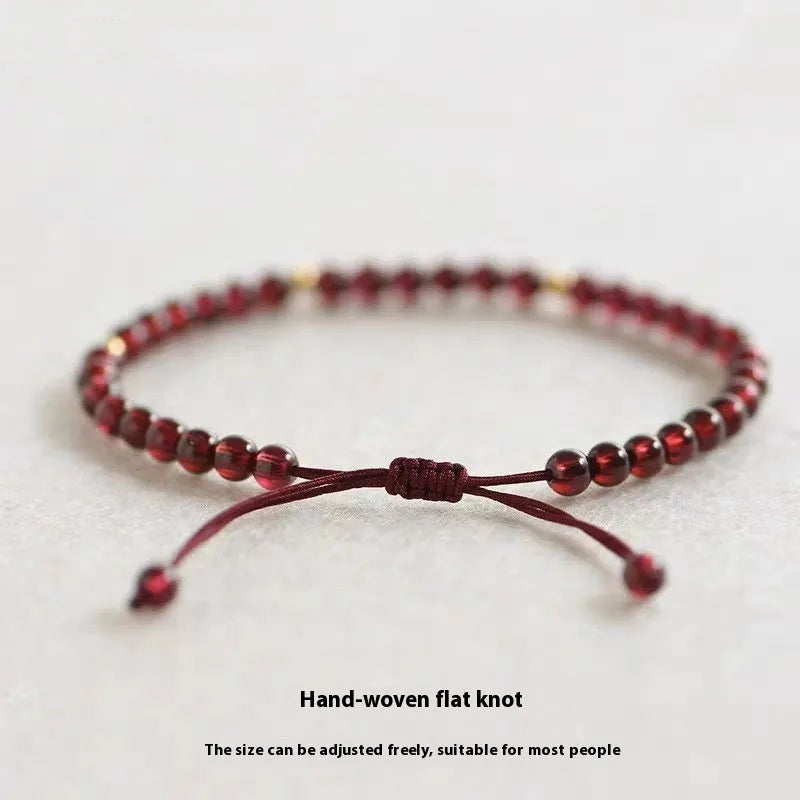 Hand-woven red garnet bracelet with flexible wire construction and national tide style