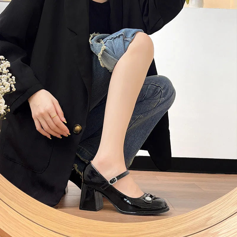 Apricot patent leather women's shoes with chunky heel, round toe, and buckle fastening.