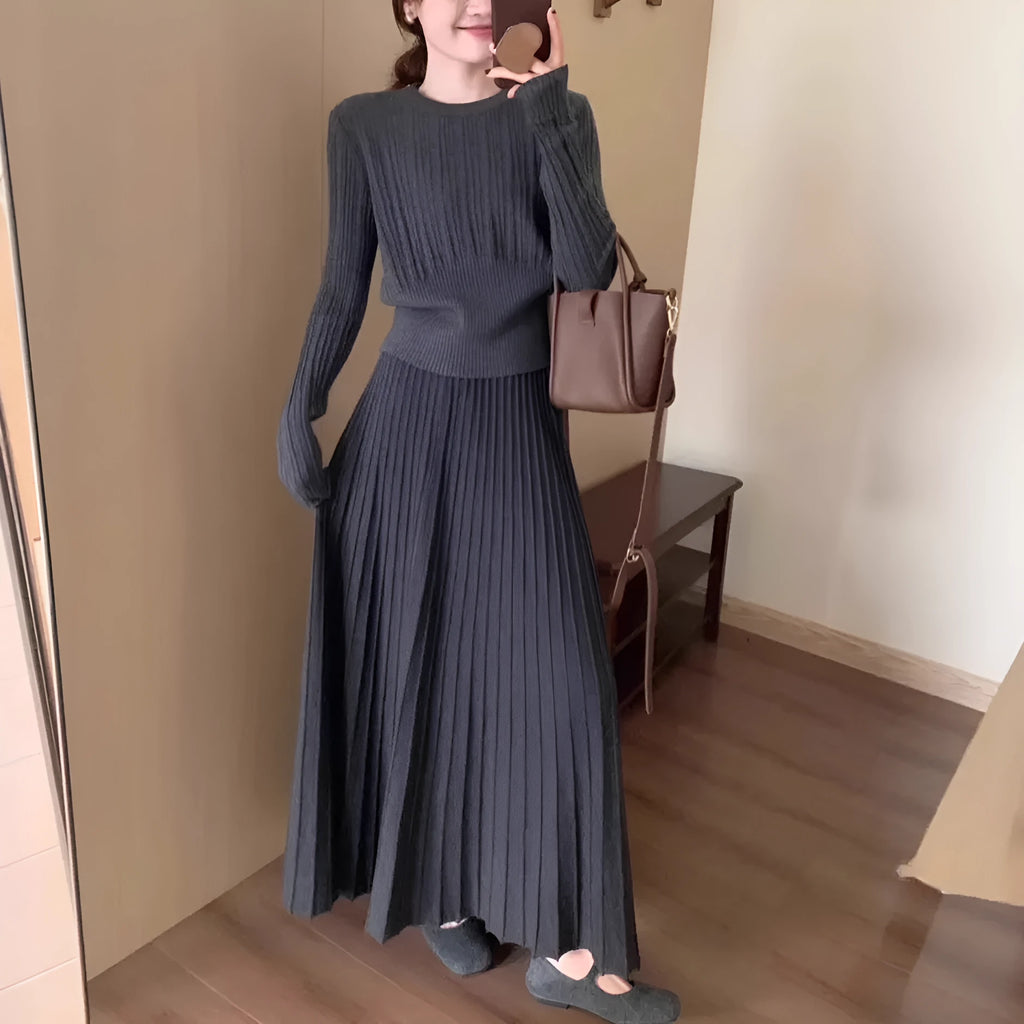 Dark grey knitted ethnic style dress suit with black collage stitching and matching skirt.