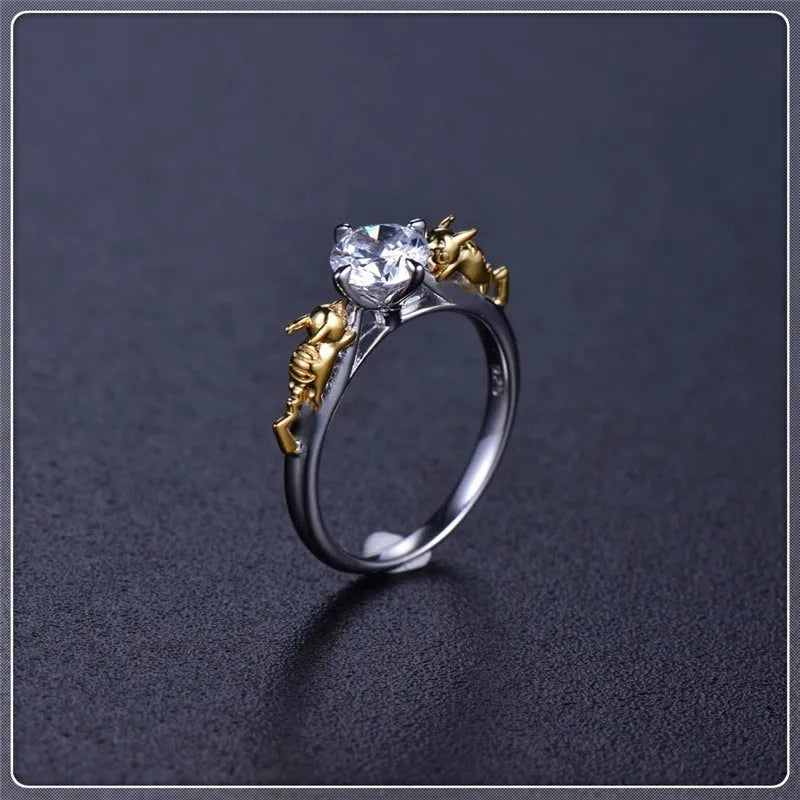 Copper crown fashion ring with black gold finish on a hand.