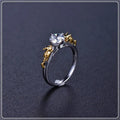 Copper crown fashion ring with black gold finish on a hand.
