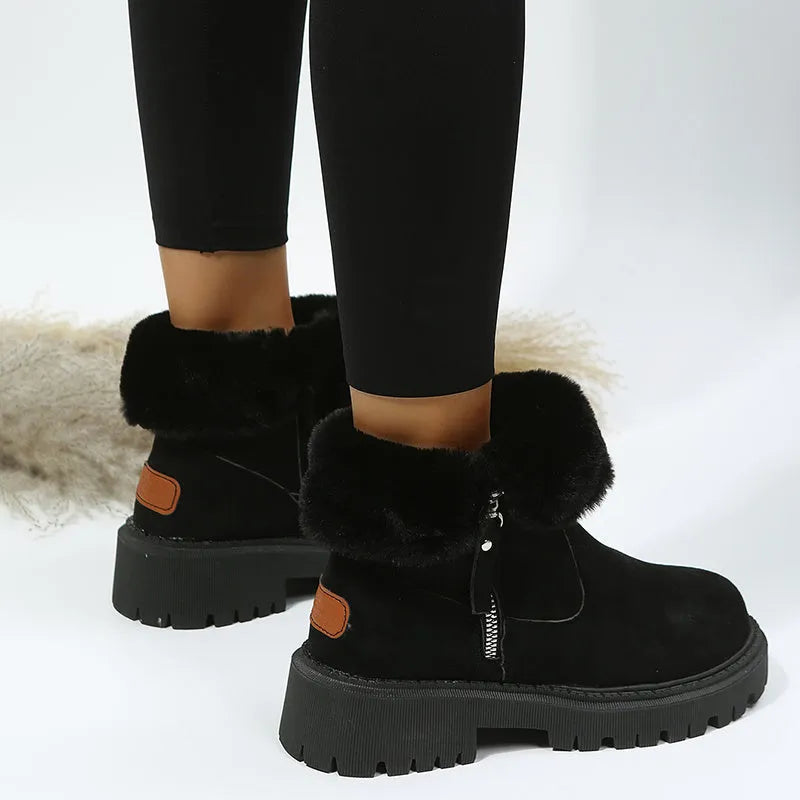 Women's black high-top snow boots with a side zipper and round toe on a non-slip rubber sole.