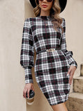 Black tight-fitting dress with voluminous lantern sleeves and decorative leather stitching detail.
