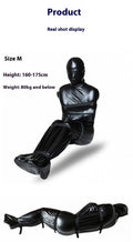 Black patent leather bondage set with body wrap and six ratchet tie-down straps