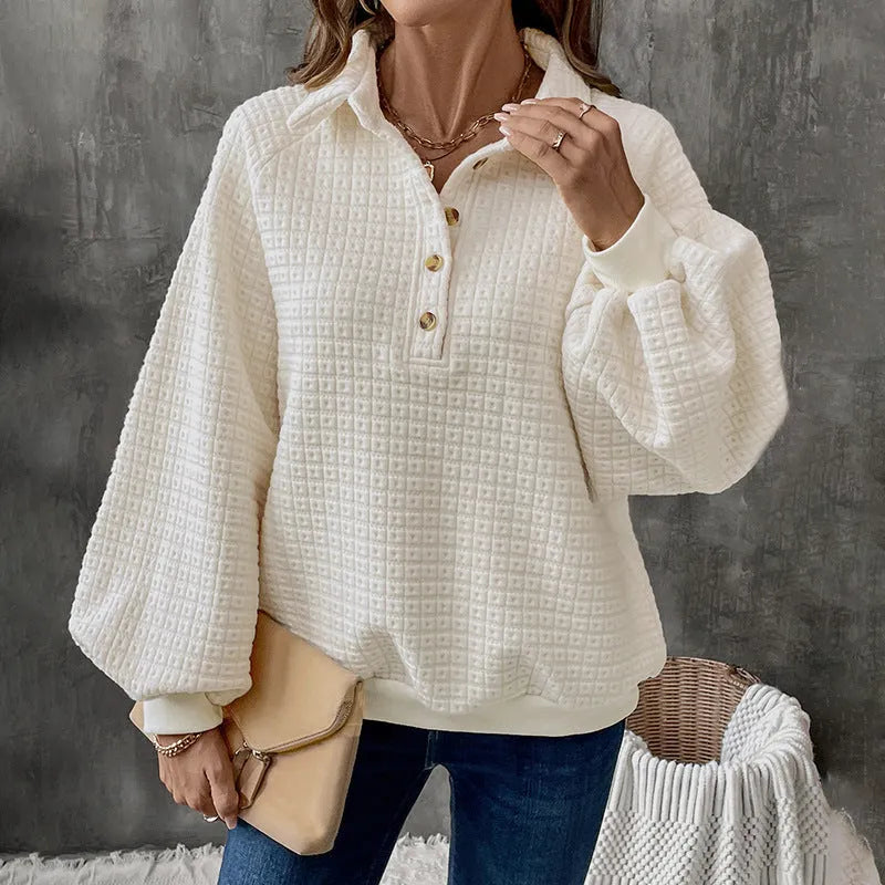 Women's milky white polo collar pullover sweater with long sleeves on a hanger.