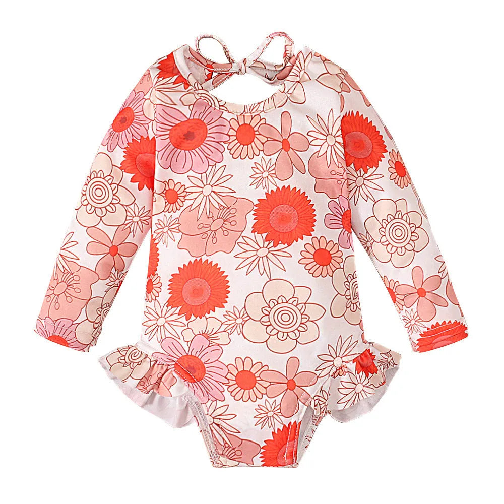 Girl's floral print open back swimsuit in orange red, shown from front and back.