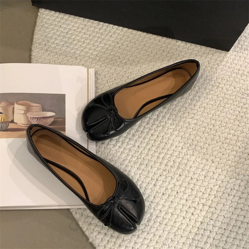 Women's flat split-toe pumps in black, silver, beige, and red with an oversleeve design.