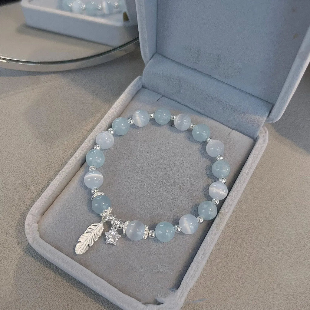 Korean style crystal bracelet with feather XINGX blue moonlight colour and eight Awn star design