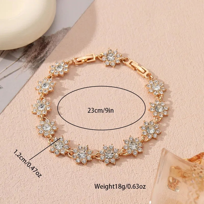 Women's zinc alloy bracelet with flower design and electroplated finish in gold and silver colour options