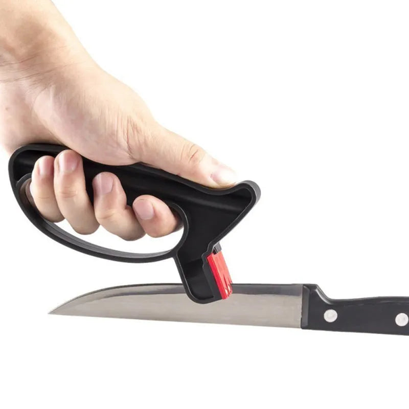 Black handheld knife and scissor sharpener with ergonomic grip on white background