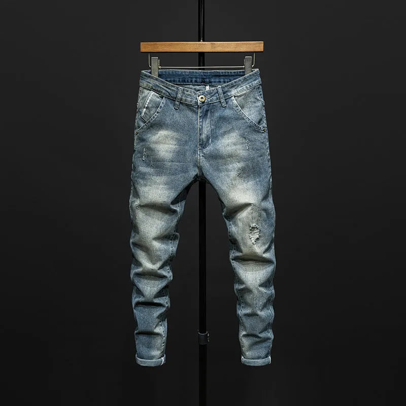 Men's slim-fit blue jeans with a mid-waist, shown in dark blue and light blue colour options.